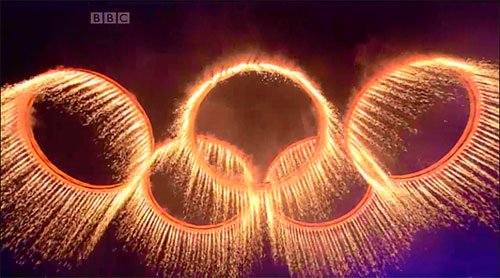 The forged Olympic Rings rise above the Stadium The forged Olympic Rings rise above the Stadium